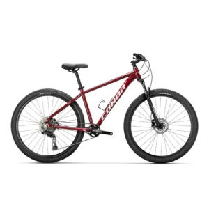 Découvrez le VTT CONOR 950 29 CUES 11S chez Carlanges Bicyclette, vélo polyvalent et stable pour vos sorties sur chemins.